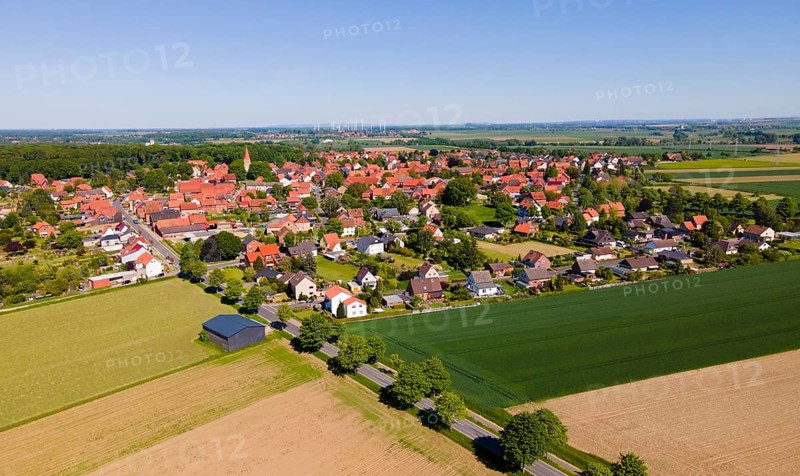 Panoramic summer view of a village with red roofs and wide fields, Adenstedt, Ilsede municipality, Peine district, Lower Saxony, Germany