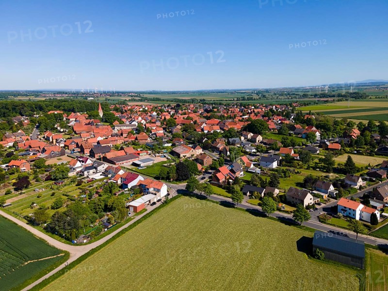 Summer village landscape with red roofs and surrounding fields, Adenstedt, Ilsede municipality, Peine district, Lower Saxony, Germany