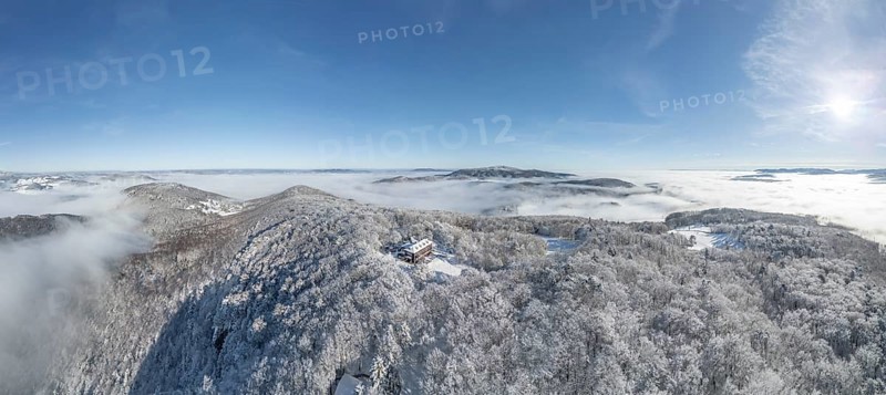 Aerial view of snowy stone walls with shelter and fog in the valley, Schwarzensee, Weissenbach an der Triesting, Lower Austria, Austria
