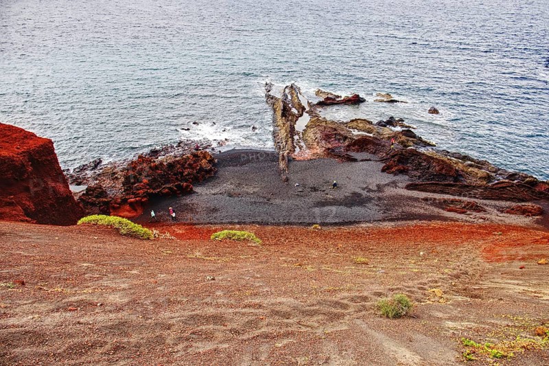 Panoramic view of the rugged coastline with red rocks and calm sea, Chargo Verde El Golfo Lanzarote