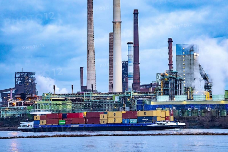 Shipping traffic on the Rhine near Duisburg-Bruckhausen, industrial setting of the ThyssenKrupp steel plant, Schwelgern coking plant, North Rhine-Westphalia, Germany