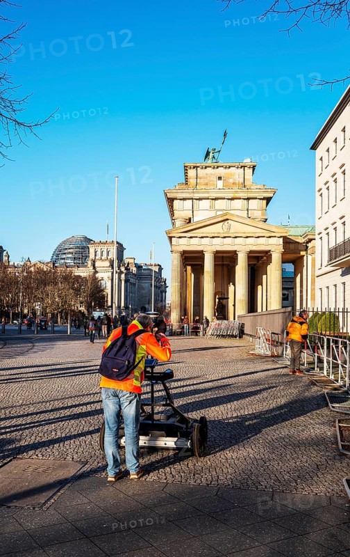Measurement of the walkway at the Brandenburg Gate near the American Embassy, Berlin, Germany