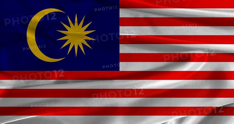 Flag of Malaysia with fabric textured background. Close up of National flag of Malaysia with realistic texture
