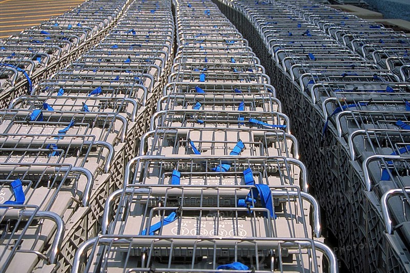 Shopping trolleys pushed together in front of a supermarket, Newton, New Jersey, USA