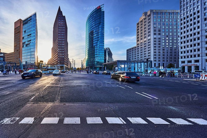 Potsdamer Platz, Forum Tower, Kollhoff Tower and Railway Tower skyscrapers, commercial buildings, modern architecture, road markings lanes, cars, pedestrians as accessories, back light, blue sky, cumulus clouds, cirrus clouds, dramatic image processing, intersection between Potsdamer Platz, Ebertstraße, Potsdamer Straße and Leipziger Platz, Berlin, capital, district-free city, federal state of Berlin, Germany