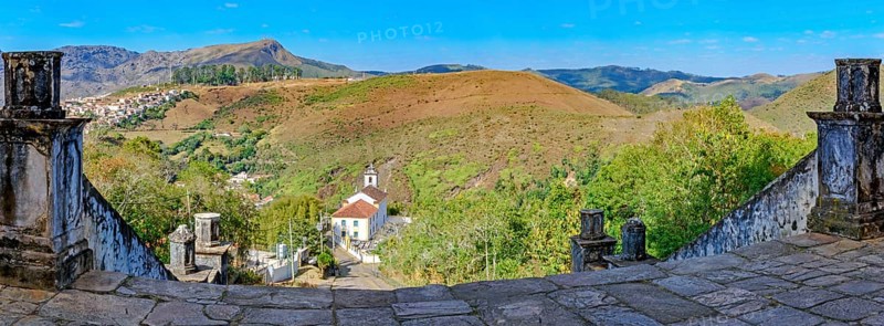 Historic churches and mountains of the city of Ouro Preto seen through stone columns, Ouro Preto, Minas Gerais, Brazil