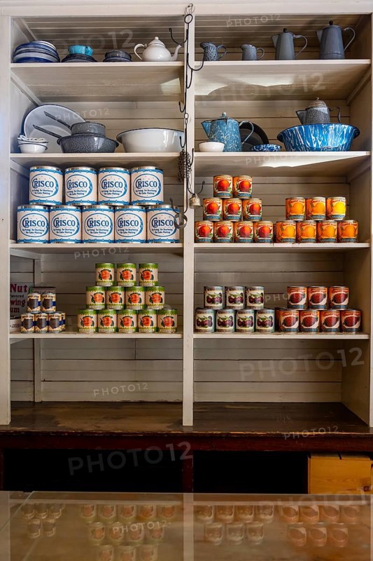 Interior view, historic restored Kennicott shopping store with historic goods display, retro food cans and dishes, Historic Kennecott Copper Mine, National Historic Landmark, Wrangell St. Elias National Park, Alaska
