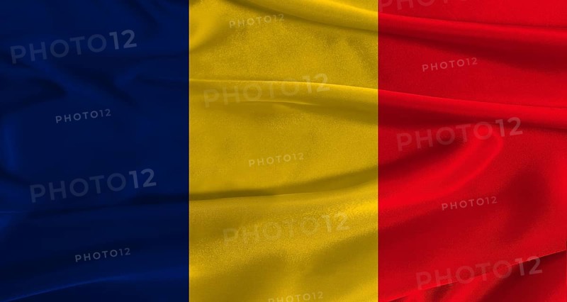 Flag of Chad with fabric textured background. Close up of National flag of Chad with realistic texture