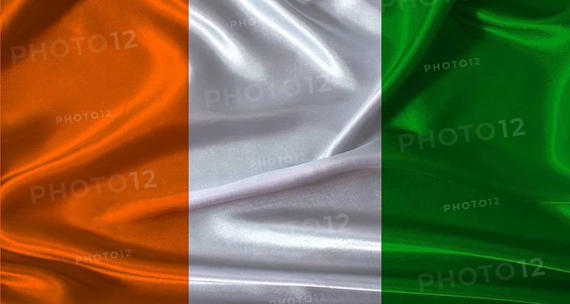 National flag of Ivory Coast with cloth texture. Ivory Coast flag with realistic texture background