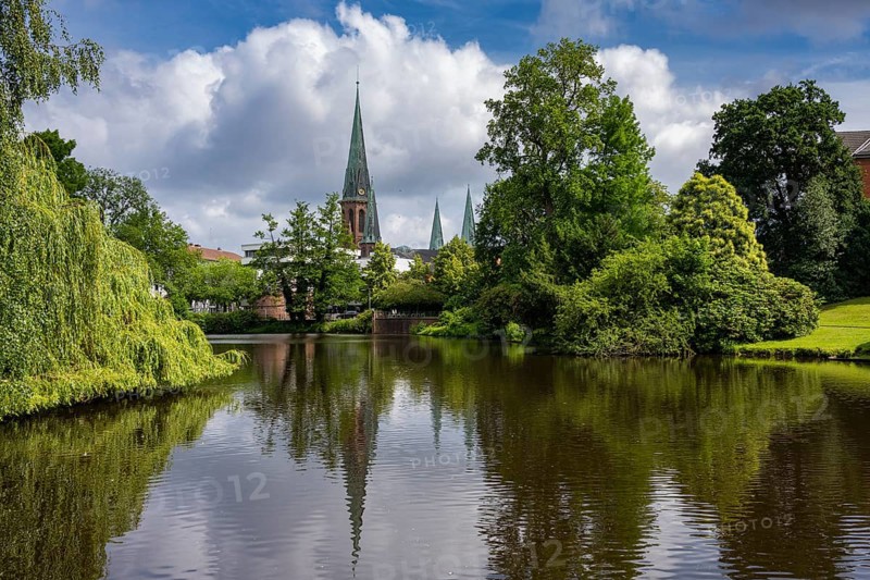 View of St. Lambert's Church from the castle pond in the castle park in Oldenburg, Oldenburg, Lower Saxony, Germany