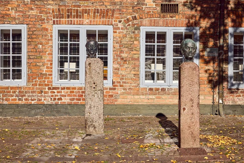 Bust of Lorenz von Stein and Wilhelm Lehmann, sculptor Manfred Sihle-Wissel, historic town hall, brick building, façade with windows, paving stone square, town hall market, Eckernförde, Rendsburg-Eckernförde district, Schleswig-Holstein, Germany