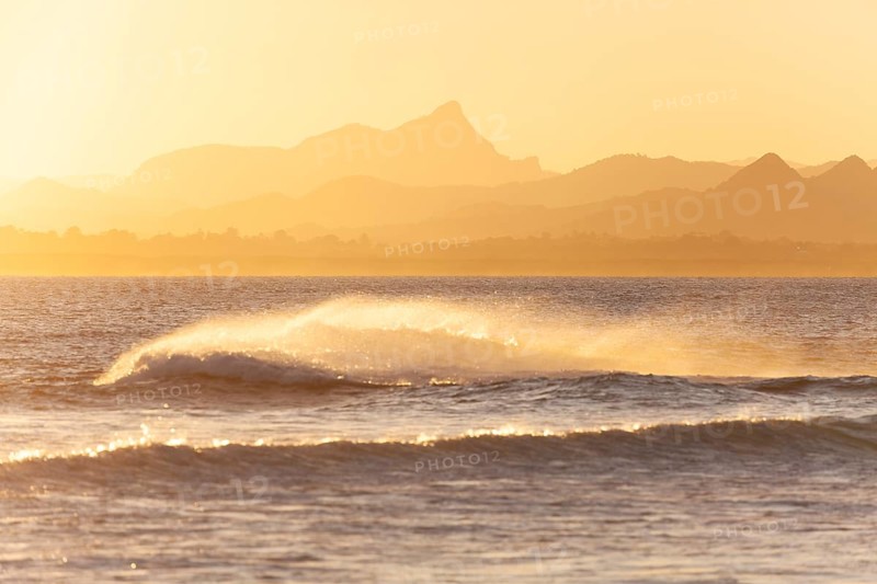 Evening light at Cape Byron with view to Mount Warning and sunlit hinterland, New South Wales, Australia