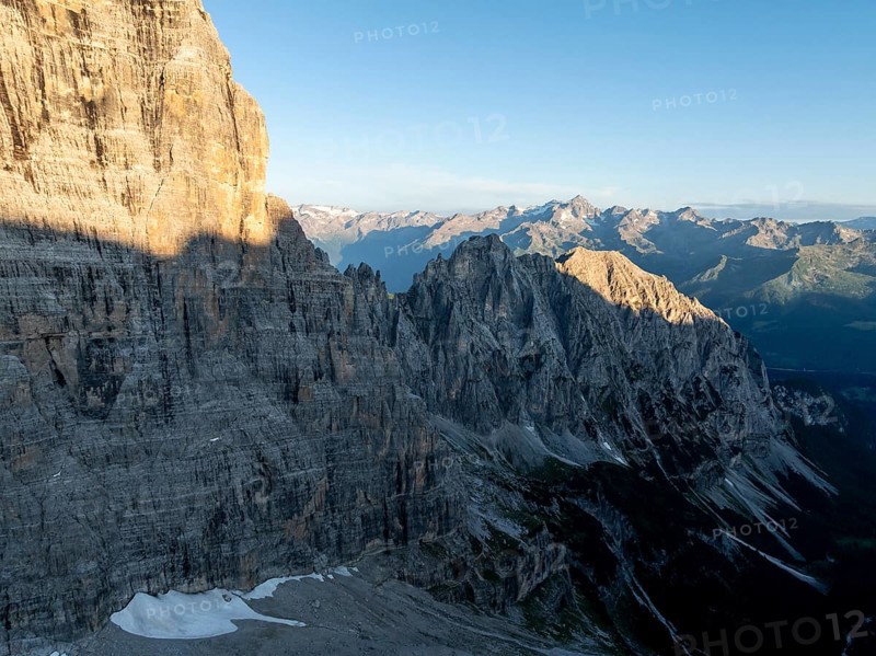 Aerial view, alpine panorama, rocky peaks at sunrise with alpine glow, picturesque mountain landscape, Brenta Dolomites, Trentino, Italy