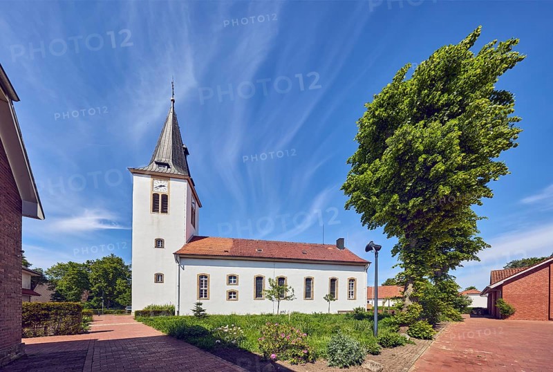 Ev. Church -Luth. parish of Vörden, church tower, general architecture, paving brick walkway, herb garden, trees, hedge, blue sky, cirrus clouds, Große Hinterstraße, district of Vörden, Neuenkirchen-Vörden, district of Vechta, Lower Saxony, Germany