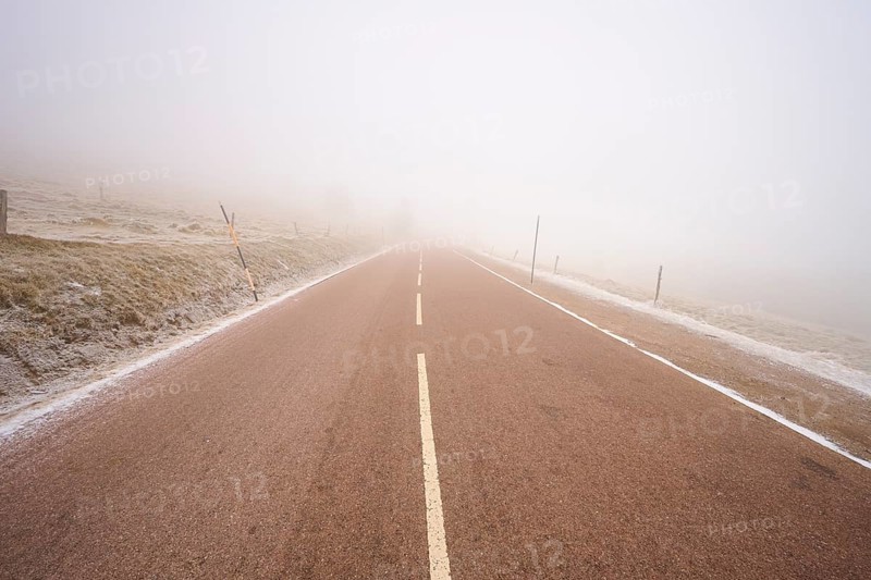 Foggy road stretching into the unknown, winter, Route de Cretes, Hohneck, La Bresse, Vosges, France