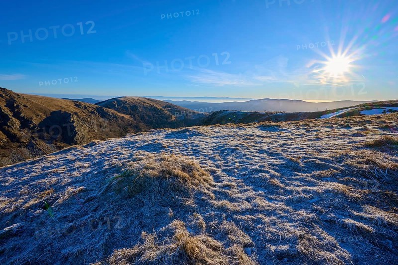 A frosty landscape under bright sunlight and a clear blue sky, winter, Route de Cretes, Hohneck, La Bresse, Vosges, France