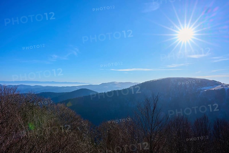 Bright sun over mountains with clear blue sky, winter view, morning, view, Rhine Valley, Martinswand, Frankental, Vosges, France