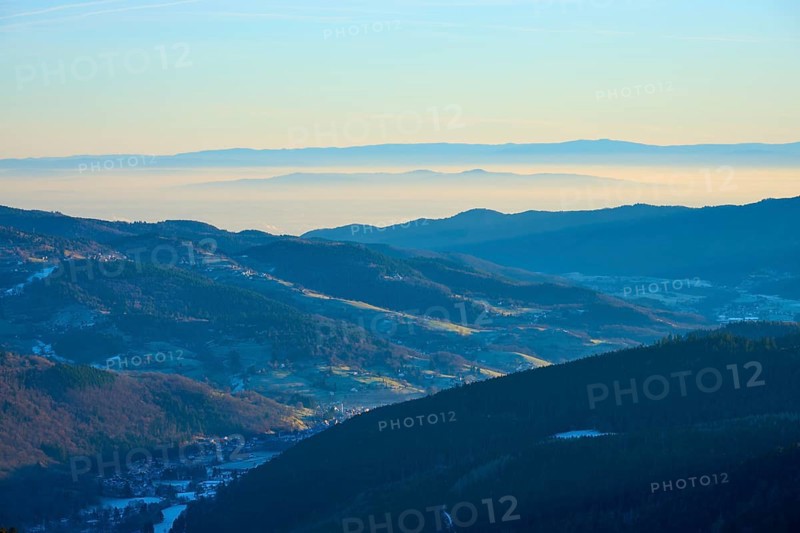 Morning view of hills and valleys with light fog and peaceful ambiance, looking towards the Rhine Valley, viewpoint, La gorge de Pierrel, Frankental, Vosges, France