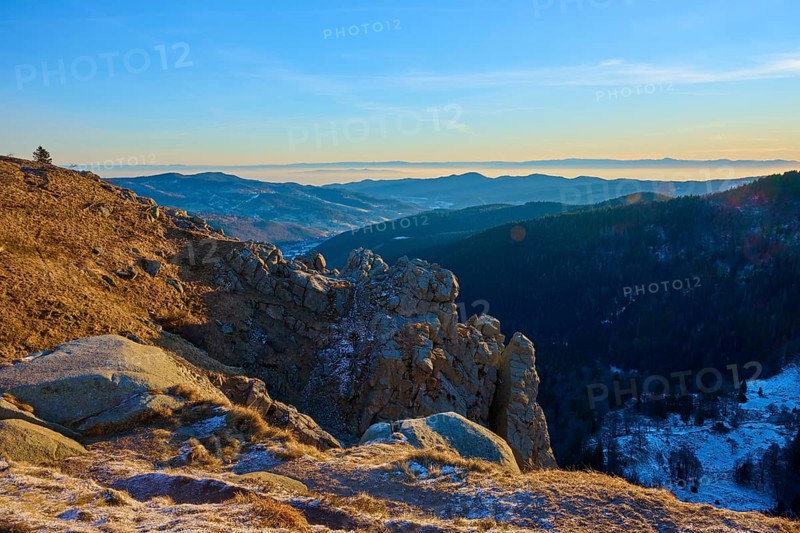 Quiet mountain landscape with rocks in the foreground and blue sky in the background, view of the Rhine Valley, viewpoint, La gorge de Pierrel, Martinswand, Frankental, Vosges, France