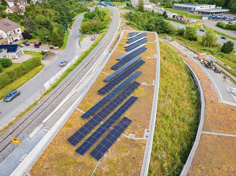 Green roof area with solar panels and surrounding infrastructure, new park and ride car park Calw Heumaden on the new Hermann Hessebahn, Calw, Germany