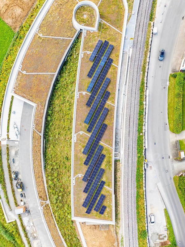 Flat roof with solar panels and surrounding infrastructure from a bird's eye view, new Park and Ride Calw Heumaden car park on the new Hermann Hessebahn, Calw, Germany