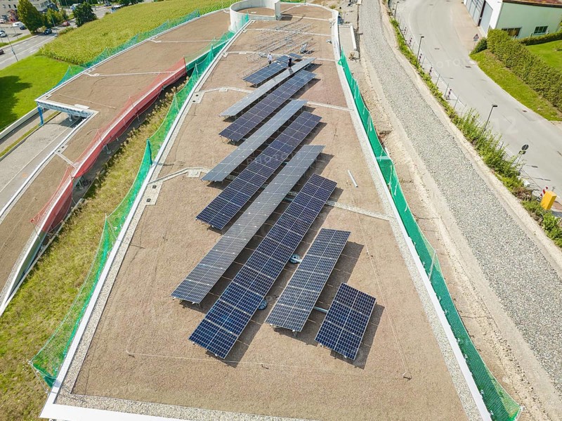 Solar panels on a green roof, surrounded by roads and buildings, new Park and Ride Calw Heumaden car park on the new Hermann Hessebahn, Calw, Germany