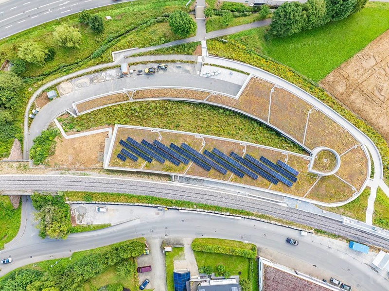Large solar systems on a covered parking lot surrounded by roads and greenery, new Park and Ride Calw Heumaden car park on the new Hermann Hessebahn, Calw, Germany