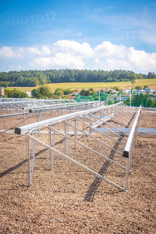 Metal structures for solar panels in an open field under a blue sky, new park and ride car park Calw Heumaden on the new Hermann Hessebahn, Calw, Germany