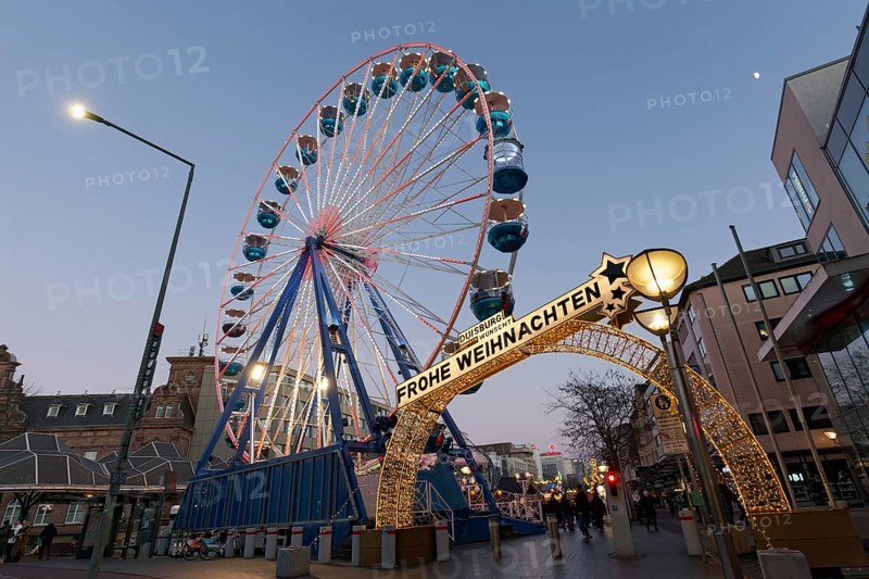Duisburg Christmas market, illuminated entrance portal with Ferris wheel, twilight, Duisburg, North Rhine-Westphalia, Germany