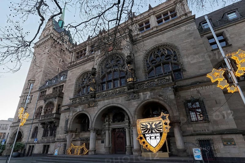 Duisburg town hall in early Renaissance style, entrance portal with Christmas decoration and city coat of arms, twilight, Duisburg, North Rhine-Westphalia, Germany