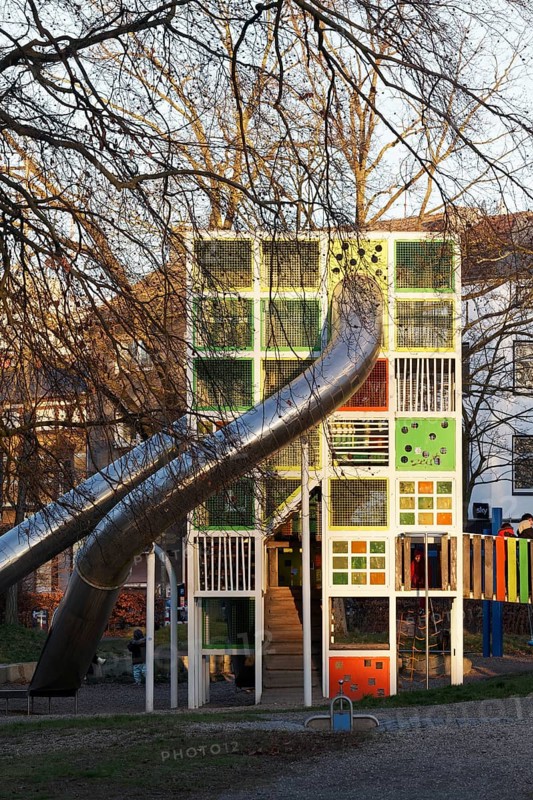 Children's playground with colorful climbing tower and slides, Immanuel-Kant-Park, Duisburg, North Rhine-Westphalia, Germany