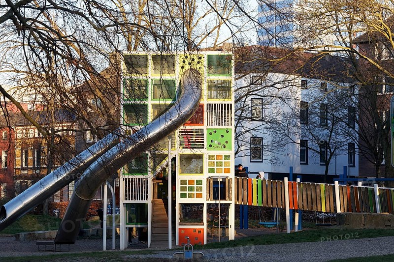 Children's playground with colorful climbing tower and slides, Immanuel-Kant-Park, Duisburg, North Rhine-Westphalia, Germany