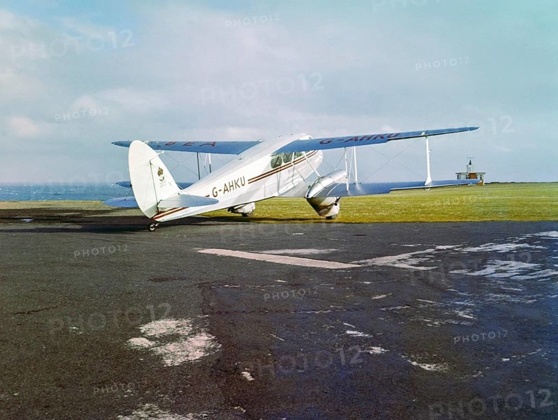 British European Airways G-AHKU De Havilland DH.89A Dragon Rapide 6 aircraft service from Land's End airport to the Scilly Isles, St Just, Cornwall, England UK early 1960s