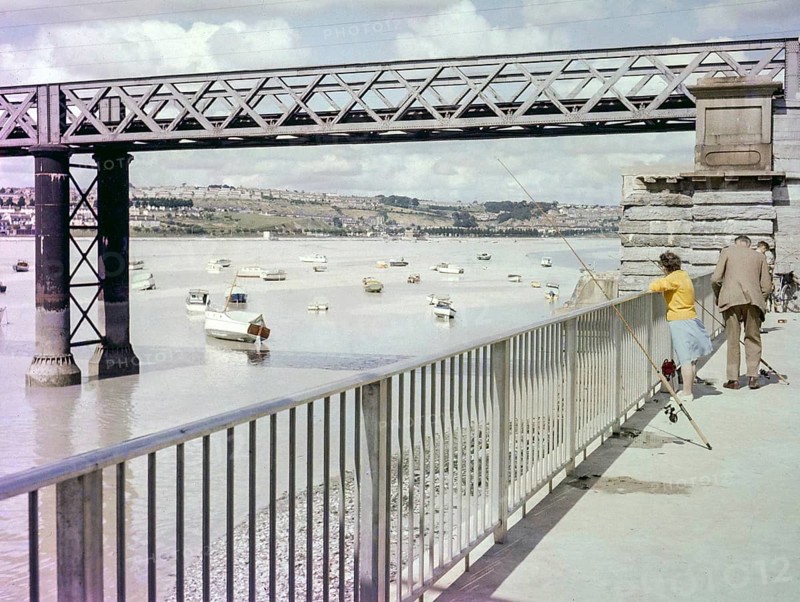 People fishing next to Laira Bridge railway bridge opened 1892, River Plym, Plymouth, Devon, England, UK early 1960s