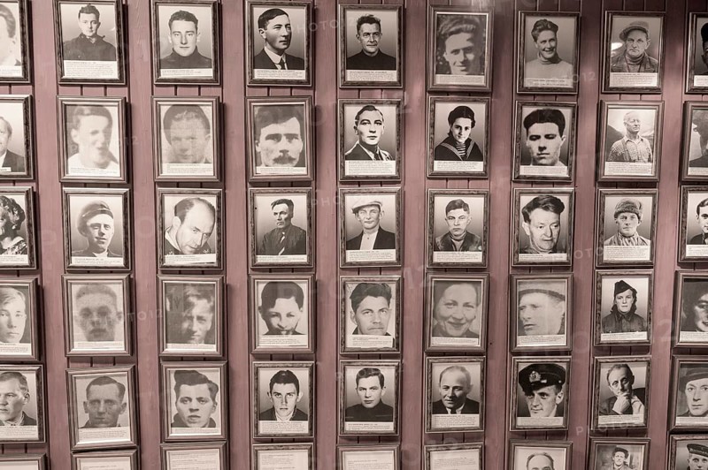 Gallery of portraits of Norwegian resistance fighters in the partisan museum in the old school of Kiberg on a wooden wall, Kiberg, Troms, Norway