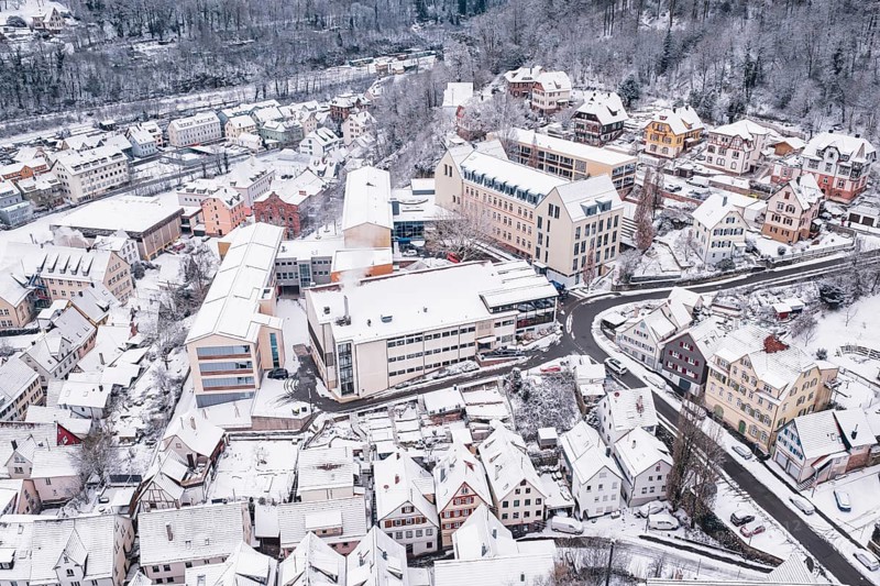 A snowy district with closely located buildings and roads, Calw, Black Forest, Germany