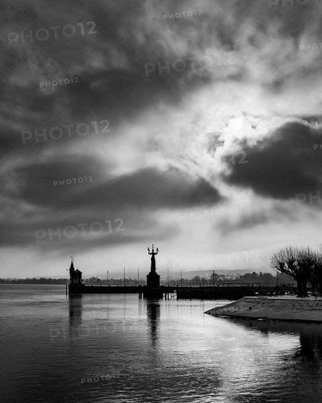 View across Lake Constance to the port of Constance with harbor entrance and the Imperia statue, on the left the old level tower, black and white photograph, district of Constance, Baden-Württemberg, Germany