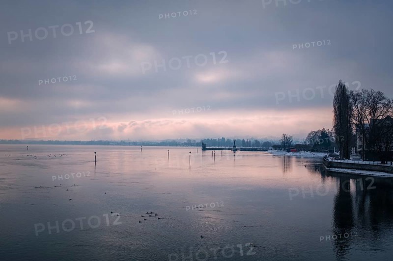 View from the old Rhine bridge across the Seerhein to the harbor entrance with the Imperia statue and the old water level tower, black and white photograph, district of Konstanz, Baden-Württemberg, Germany