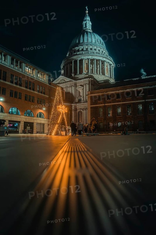 Illuminated St Paul Cathedral with decorated Christmas tree and festive night atmosphere, London, England, Great Britain