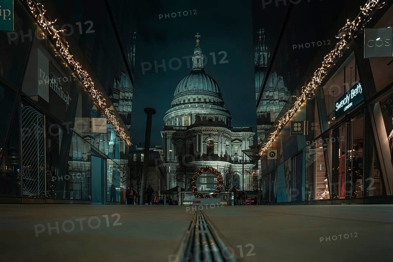 Illuminated St Paul Cathedral between modern glass facades with festive lighting, London, England, Great Britain