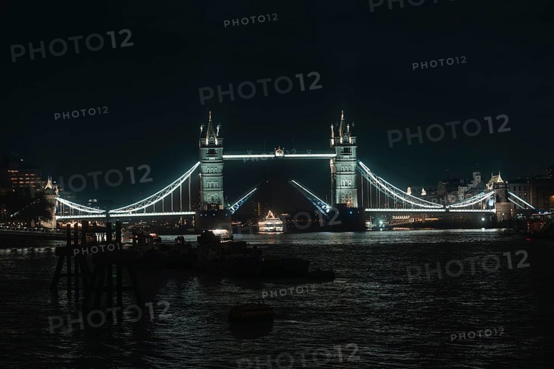 Iconic Tower Bridge, elegantly lit over water, London, England, Great Britain
