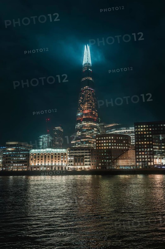 The illuminated Shard skyscraper at night in London, London, England, Great Britain
