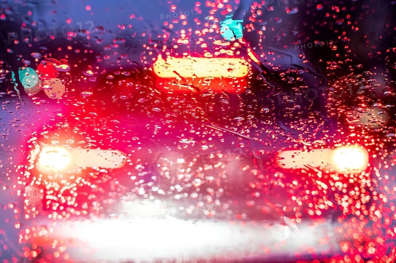 Driving in winter, in snow, rain, rear lights, brake lights