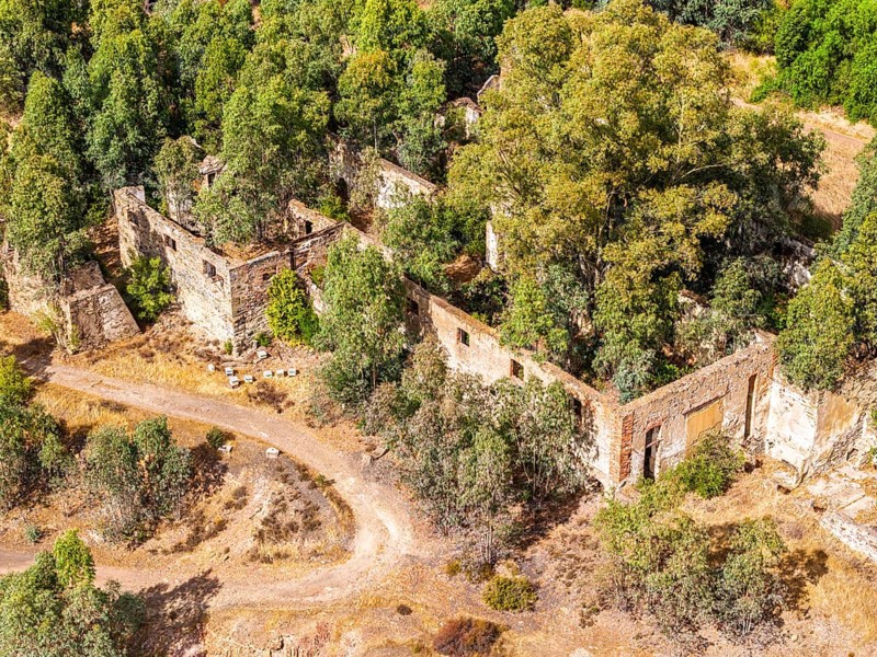 Ruins of former workshop halls, Mina de Sao Domingos, historic copper open-pit mine, aerial view, Portugal