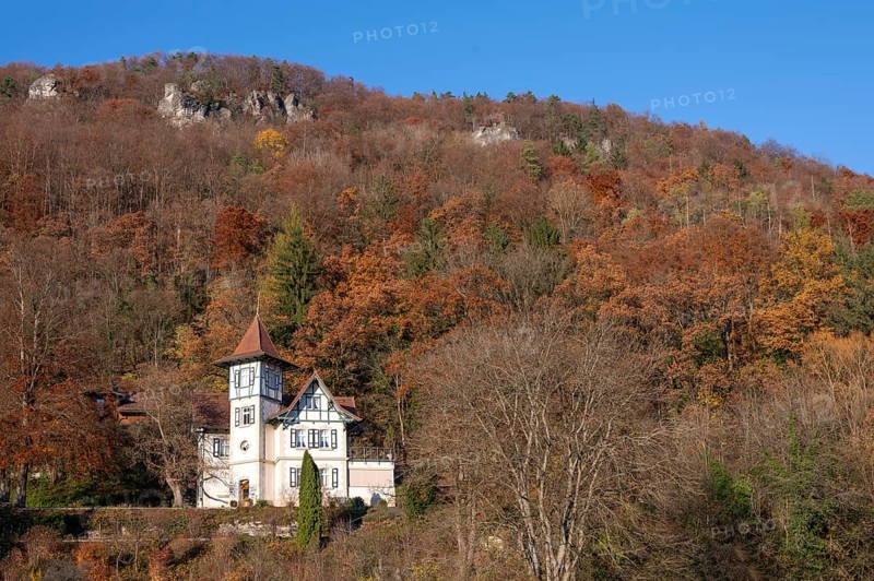 Historic villa in mixed autumn forest in Franconian Switzerland, Muggendorf, Upper Franconia, Bavaria, Germany