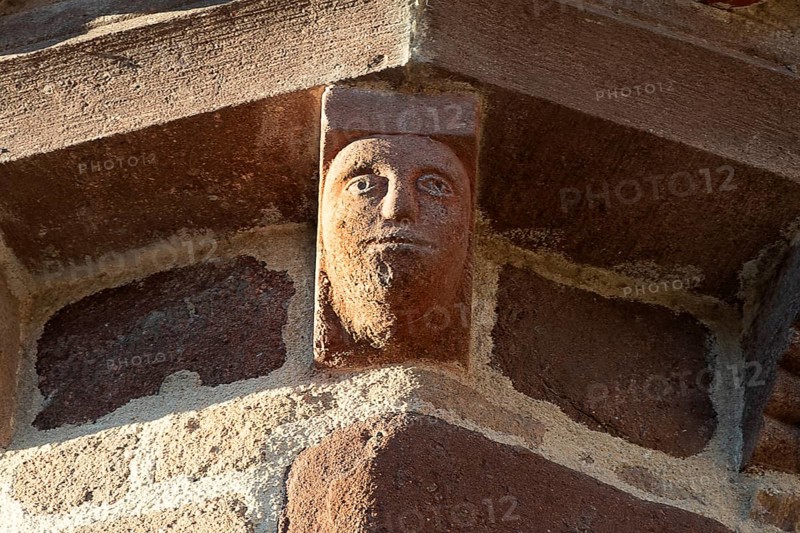 Azerat village. Sculpture of Roman church Saint-Jean-Baptiste . Haute Loire. Auvergne Rhone Alpes. France