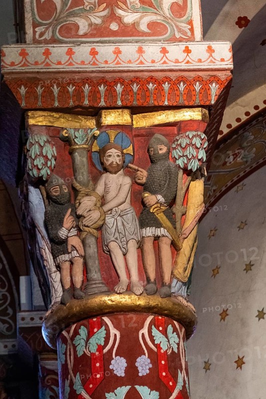 Issoire. Pillar (Jesus is tied to a column by two soldiers, to be flogged) . Saint-Austremoine Roman chuch, Auvergne Rhone Alpes, France