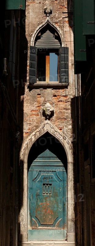 Old entrance gate at the end of Calle Mezzo, Sestiere Castello, Venice, Veneto, Italy