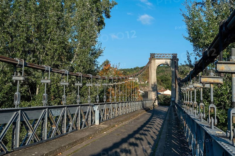 Suspension bridge of Coudes village on river Allier. Puy de Dome. Auvergne Rhone Alpes. France