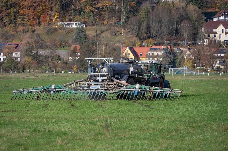 Farmer fertilizing his meadows by tow hose, Eschenbach, Middle Franconia, Bavaria, Germany